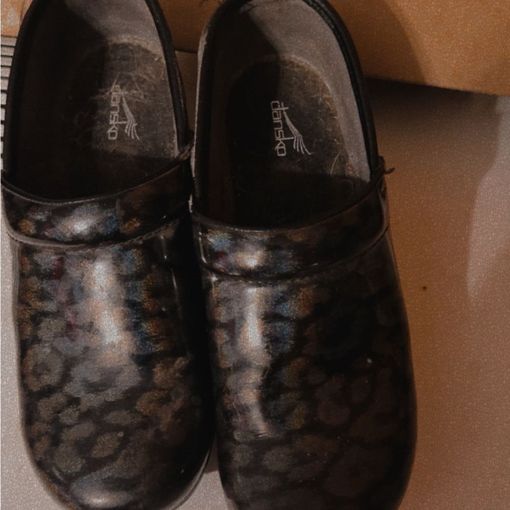 Dansko Black and Brown Animal Print Clogs